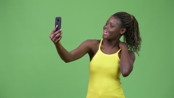 Young African woman taking selfie — Stock Video