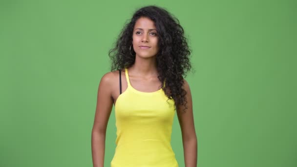 Young happy beautiful Hispanic woman with curly hair — Stock Video