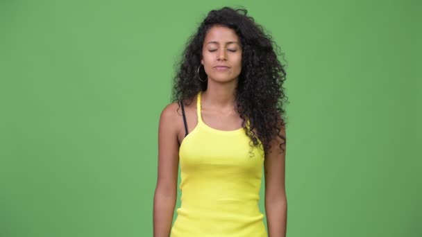 Young happy beautiful Hispanic woman relaxing with eyes closed — Stock Video