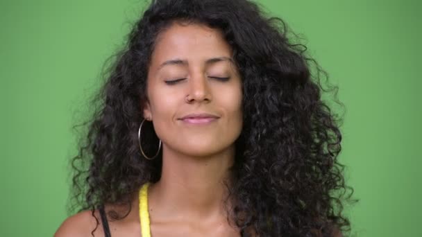 Young happy beautiful Hispanic woman relaxing with eyes closed — Stock Video