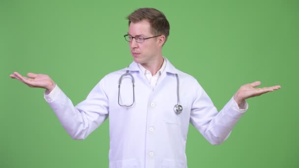Young Man Doctor Showing Copyspace — Stock Video