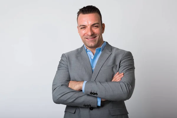 Confident Businessman Wearing Suit With Arms Crossed Isolated Against White Background — Stock Photo, Image