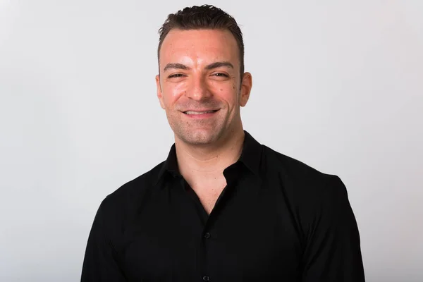 Portrait Of Handsome Businessman Smiling Against White Background — Stock Photo, Image