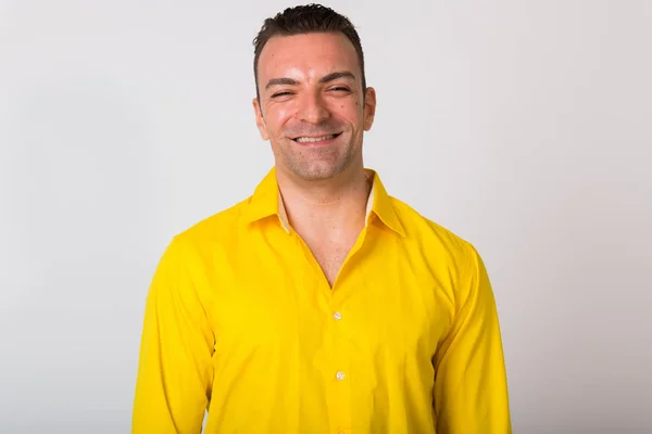 Portrait Of Man Wearing Yellow Shirt Against White Background — Stock Photo, Image