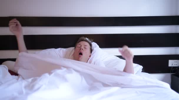 Young Man Waking Up At Morning In Bedroom — Stock Video