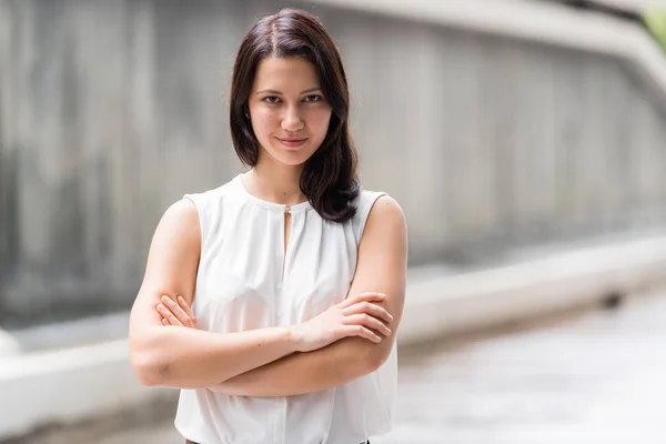 Portrait Of Beautiful Young Woman Outdoors With Arms Crossed — Stock Photo, Image