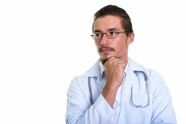 Close up of young handsome man doctor thinking while looking at — Stock Photo, Image