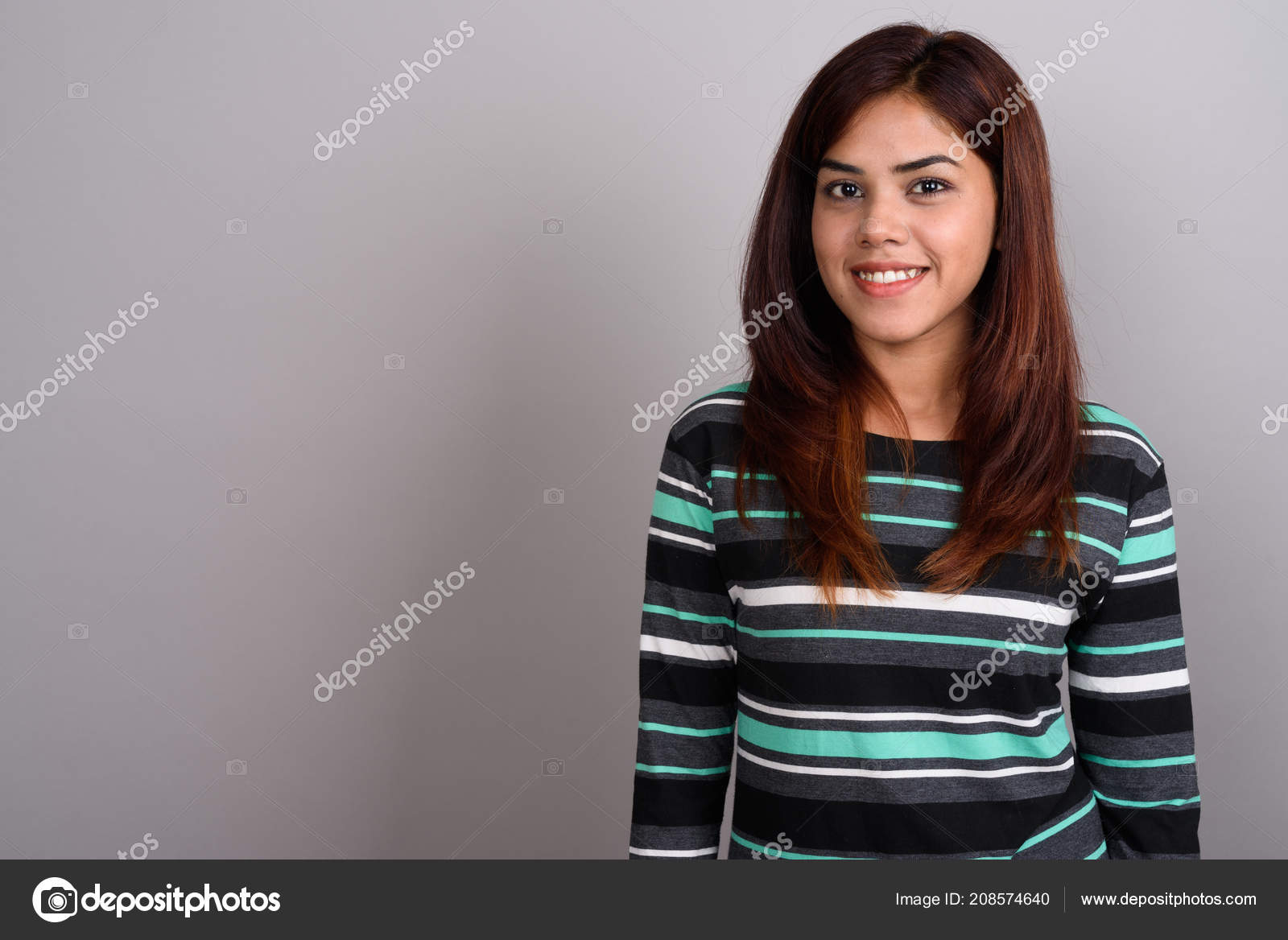 Young beautiful Indian woman against gray background Stock Photo by ©amazingmikael 208574640 Young beautiful Indian woman against gray background Stock Photo by ©amazingmikael 208574640