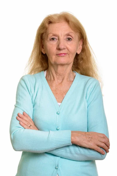 Studio shot of senior woman with arms crossed — Stock Photo, Image