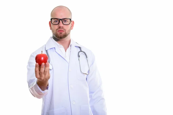 Studio shot of young bald muscular man doctor — Stock Photo, Image