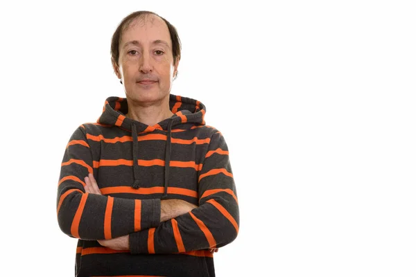 Studio shot of mature man with arms crossed — Stock Photo, Image