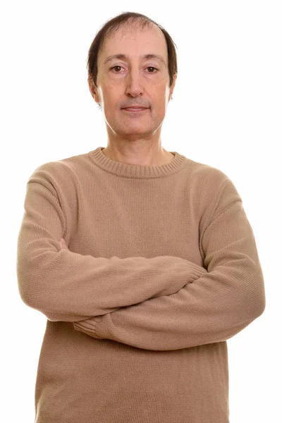 Studio shot of mature man with arms crossed — Stock Photo, Image