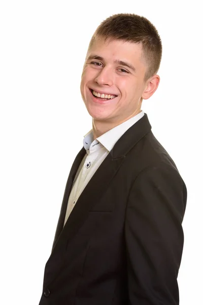 Studio shot van jonge gelukkige zakenman glimlachen — Stockfoto