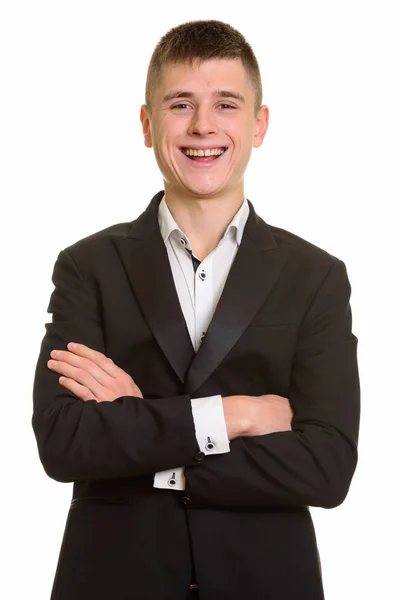 Studio shot de jeune homme d'affaires heureux souriant avec les bras croisés — Photo