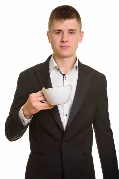 Studio ditembak pengusaha muda memegang cangkir kopi — Stok Foto