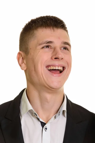 Στιγμιότυπο του νεαρού ευτυχισμένου επιχειρηματία χαμογελώντας και σκεπτόμενος — Φωτογραφία Αρχείου