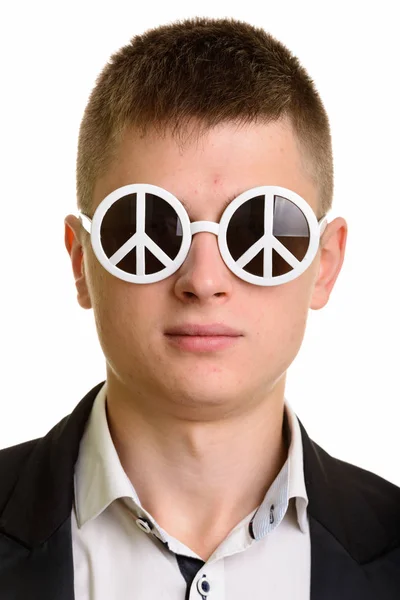 Face of young businessman wearing sunglasses with peace sign — Stock Photo, Image