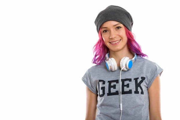 Studio záběr šťastný geek dívka usmívá se sluchátky kolem ne — Stock fotografie