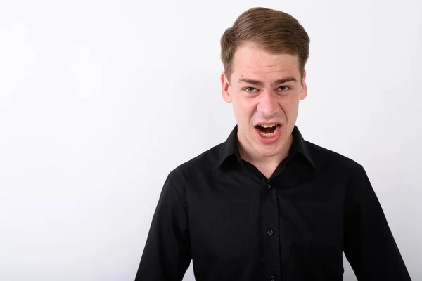 Young handsome businessman against white background — Stock Photo, Image