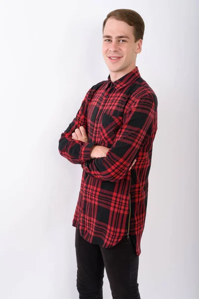 Jovem homem bonito vestindo camisa quadriculada vermelha contra o bac branco — Fotografia de Stock