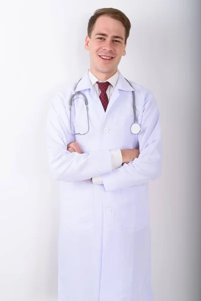 Fiatal jóképű férfi orvos fehér háttér — Stock Fotó