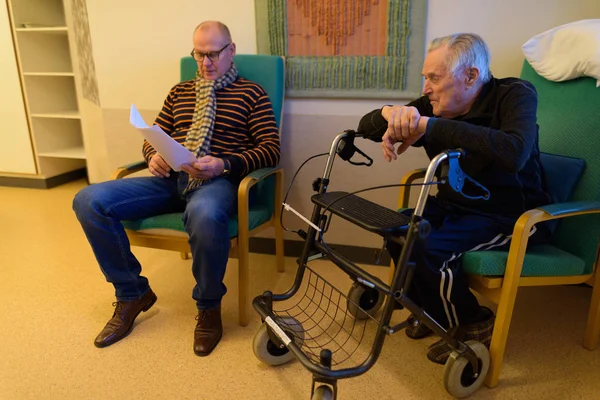 Mature man and senior man together at nursing home in Turku, Fin — Stock Photo, Image