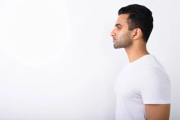Young handsome Indian man against white background — Stock Photo, Image