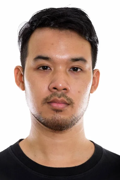 Studio shot of face of young Asian man — Stock Photo, Image