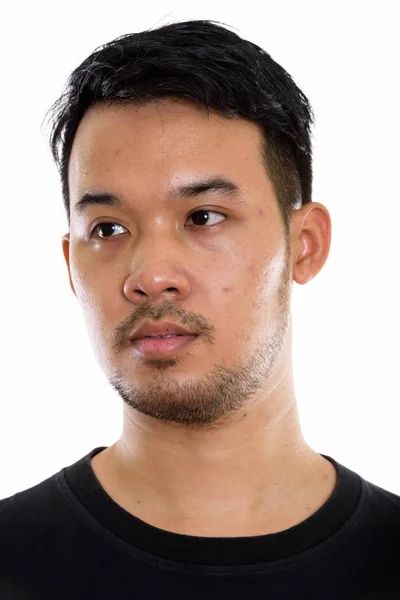Mesafede bakarken düşünme genç Asyalı adamın yüzünü — Stok fotoğraf