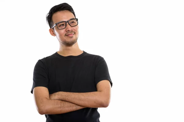 Studio colpo di giovane asiatico uomo pensiero mentre indossa occhiali da vista — Foto Stock