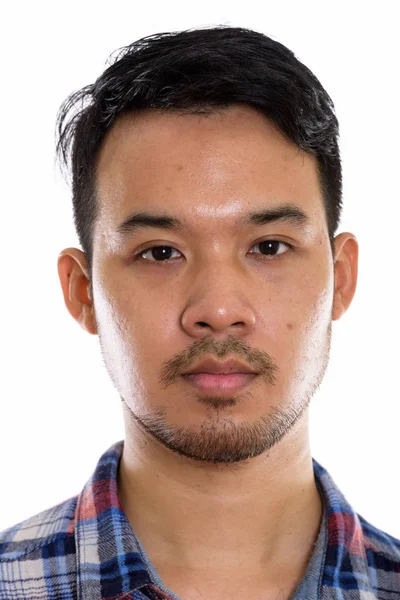 Studioaufnahme des Gesichts eines jungen asiatischen Mannes — Stockfoto