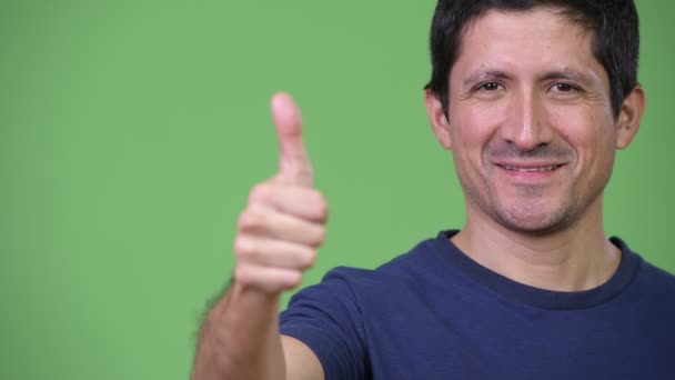 Close-up of happy Hispanic man giving thumbs up — Stock Video