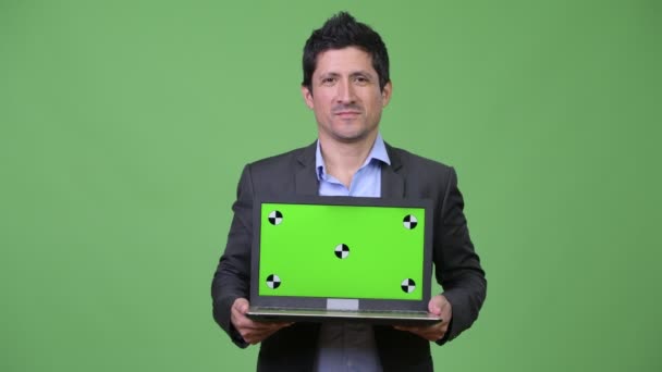Happy Hispanic businessman showing laptop — Stock Video