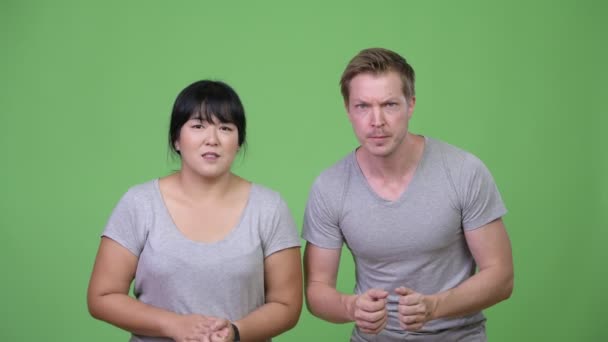 Joven pareja multiétnica recibiendo malas noticias juntos — Vídeos de Stock