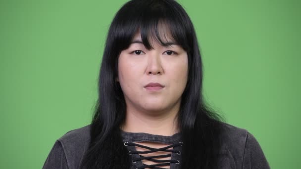 Head shot of beautiful overweight Asian woman — Stock Video