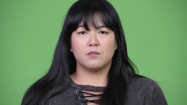 Head shot of beautiful overweight Asian woman smiling — Stock Video