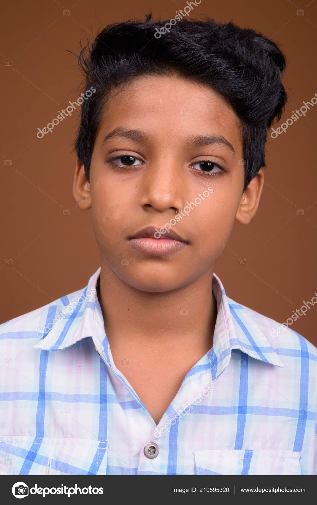 PONDICHERY, PUDUCHERRY, TAMIL NADU, INDIA - SEPTEMBER Circa, 2018. An  Unidentified Poor Indian Boy With A Smiling And Serious Eyes Looks In The  Camera Stock Photo, Picture and Royalty Free Image. Image 120103739.