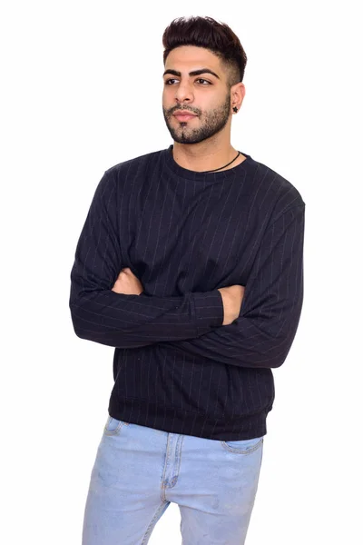 Studio shot of young handsome Indian man with arms crossed isola — Stock Photo, Image