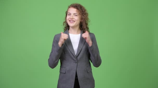 Young happy beautiful businesswoman giving thumbs up — Stock Video