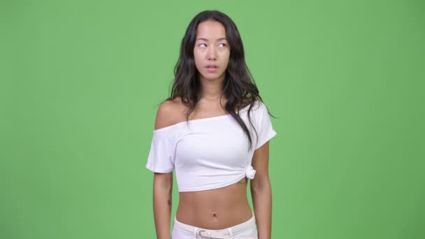 Young beautiful multi-ethnic woman looking bored — Stock Video