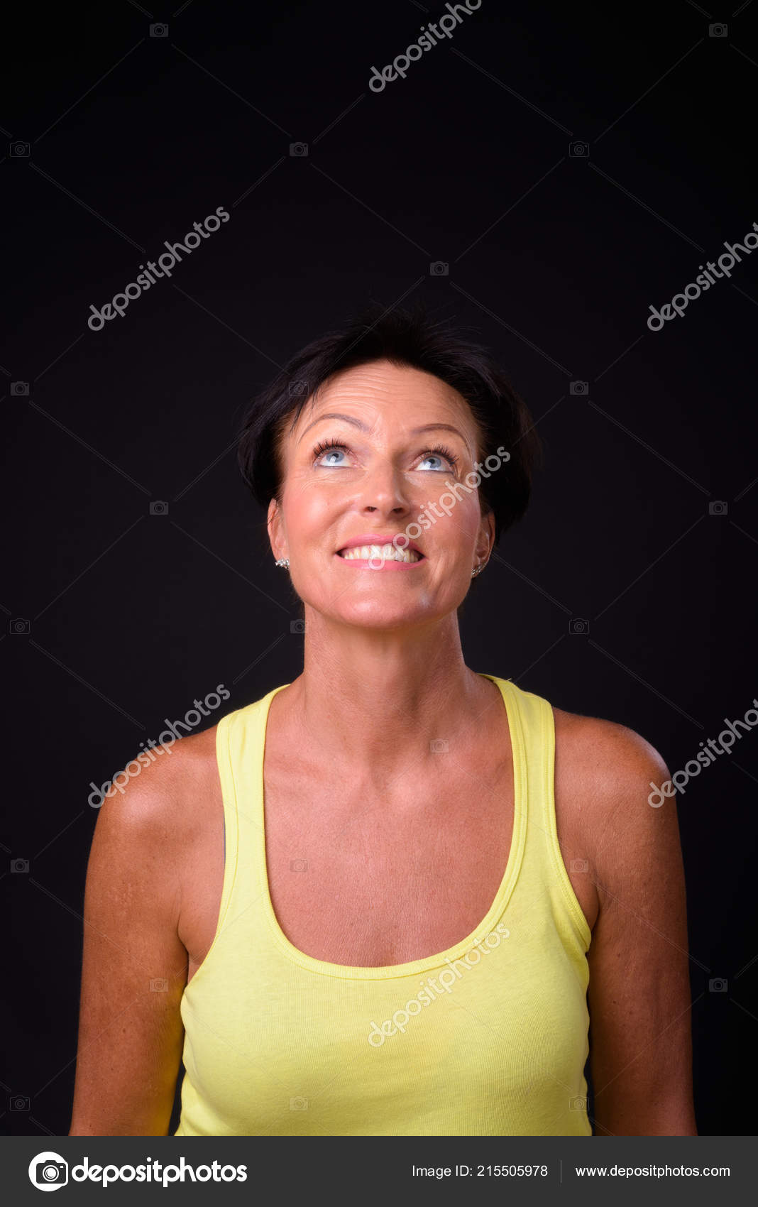 Mature Beautiful Woman With Short Hair Against Black Background