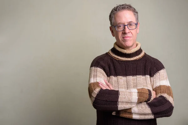 Mature man wearing turtleneck sweater and eyeglasses — Stock Photo, Image