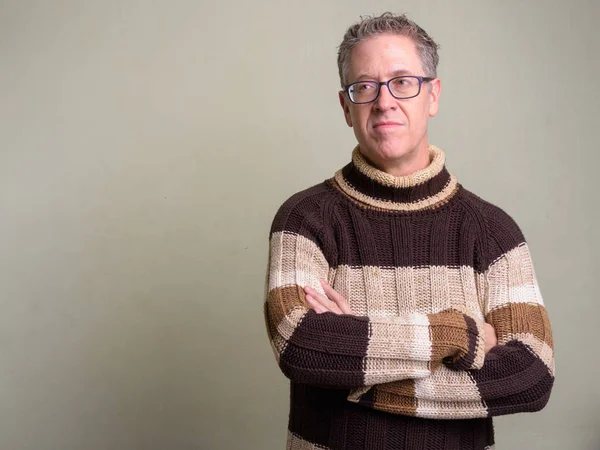 Mature man wearing turtleneck sweater and eyeglasses — Stock Photo, Image