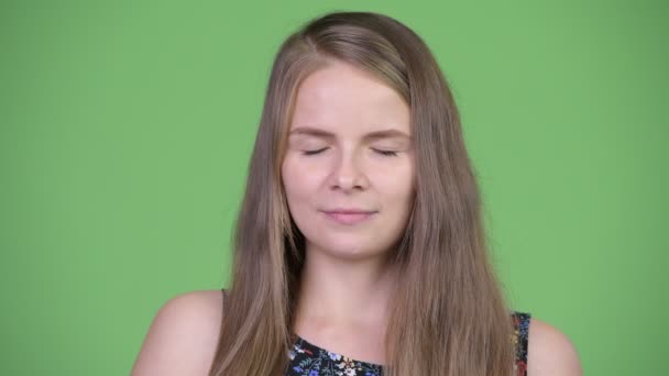 Young happy beautiful woman relaxing with eyes closed — Stock Video