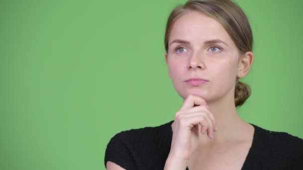 Young happy beautiful businesswoman thinking — Stock Video