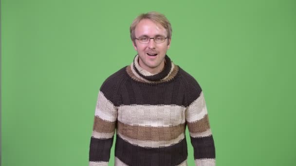 Studio shot of happy handsome man looking excited — Stock Video