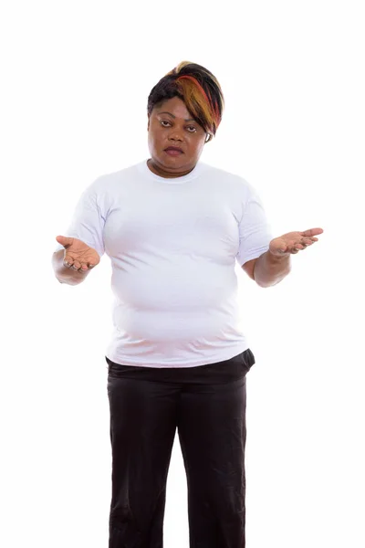 Studio shot of fat black African woman standing while looking co — Stock Photo, Image