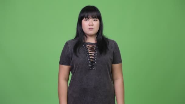 Beautiful overweight Asian woman covering mouth as three wise monkeys concept — Stock Video