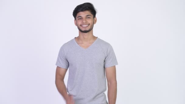 Young happy bearded Indian man giving thumbs up — Stock Video