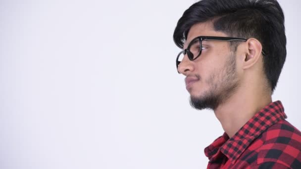 Profile view of young handsome bearded Indian hipster man — Stock Video